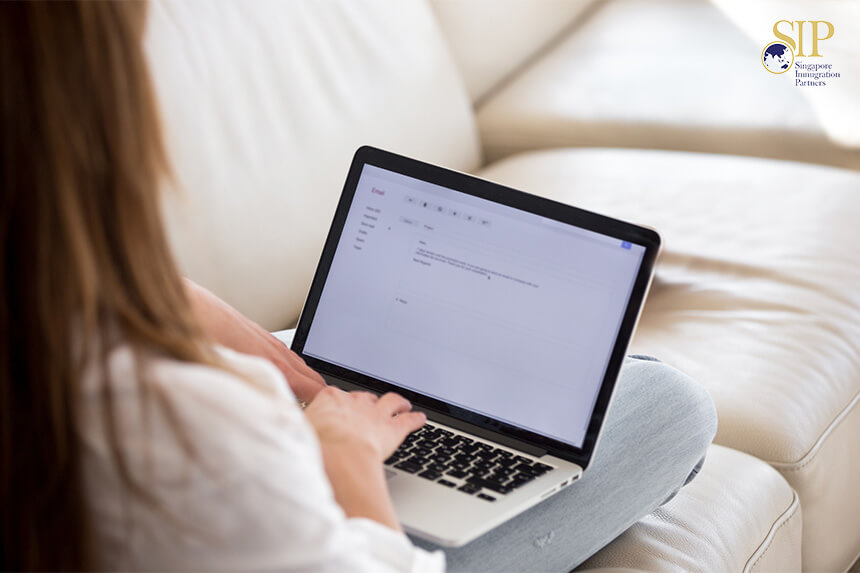 A Foreigner Typing On A Laptop