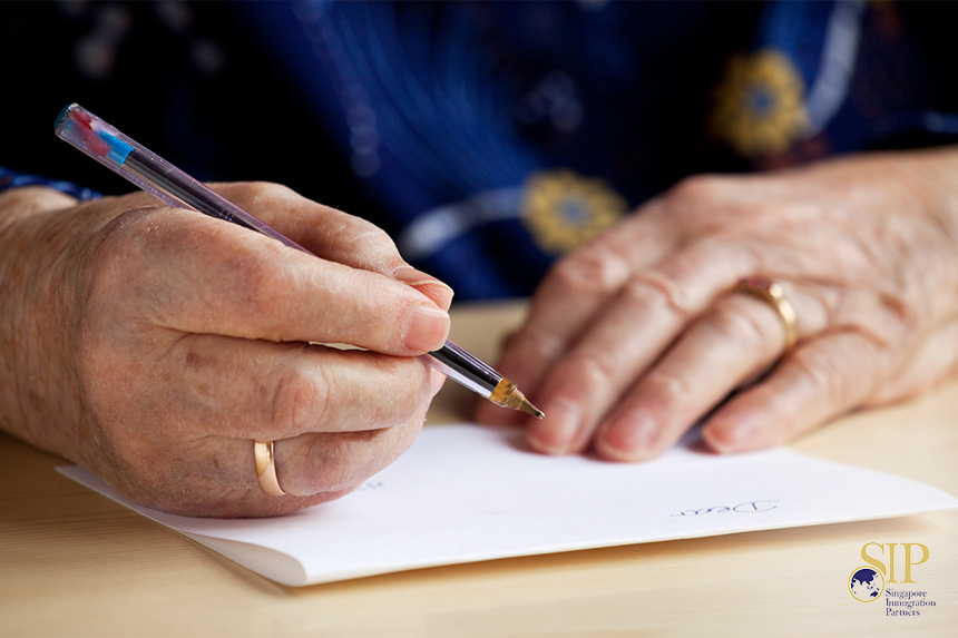 Image of man writing a letter