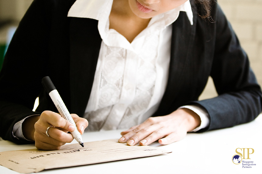 Women writing an address on an envelope